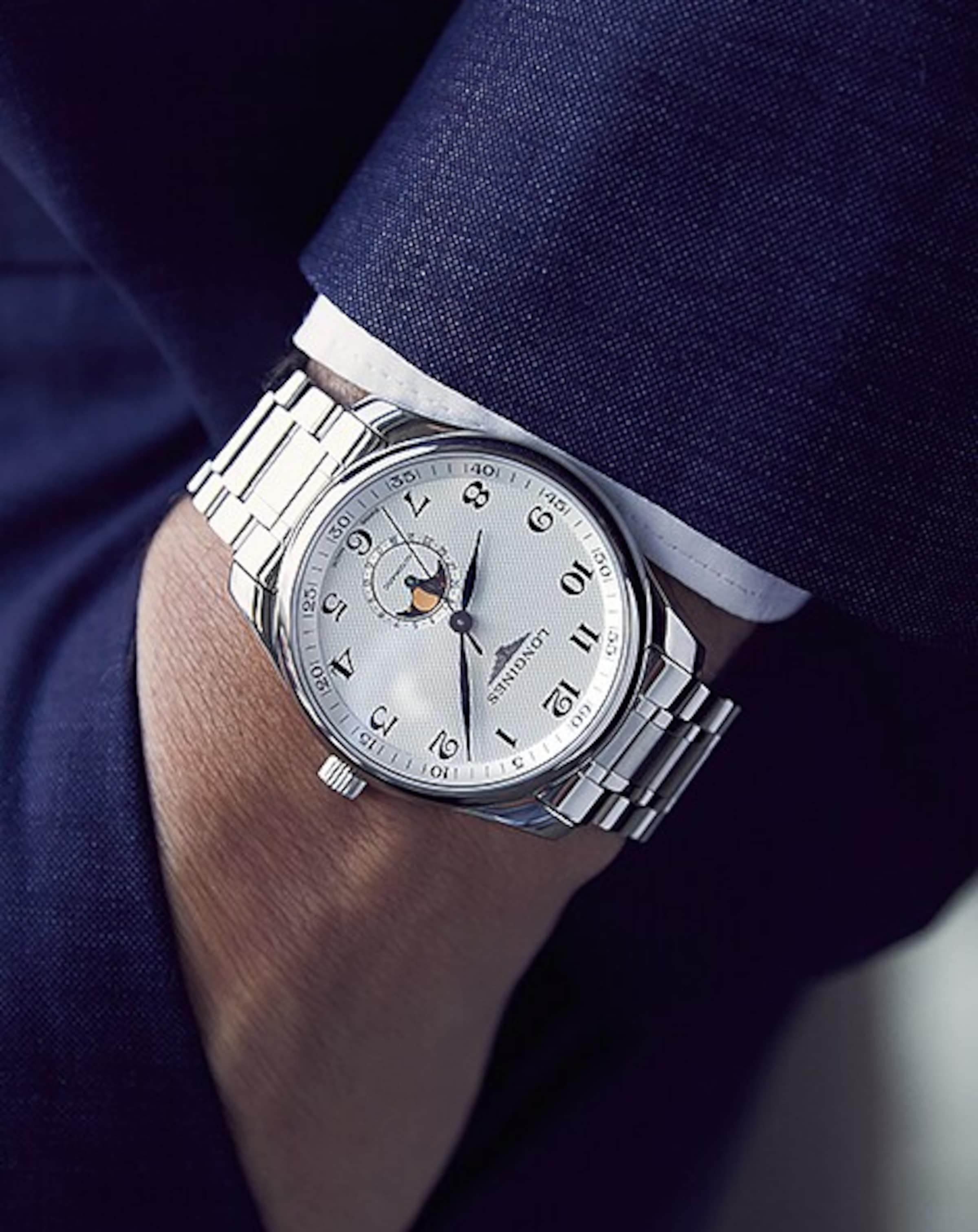 a Longines watch on a wrist