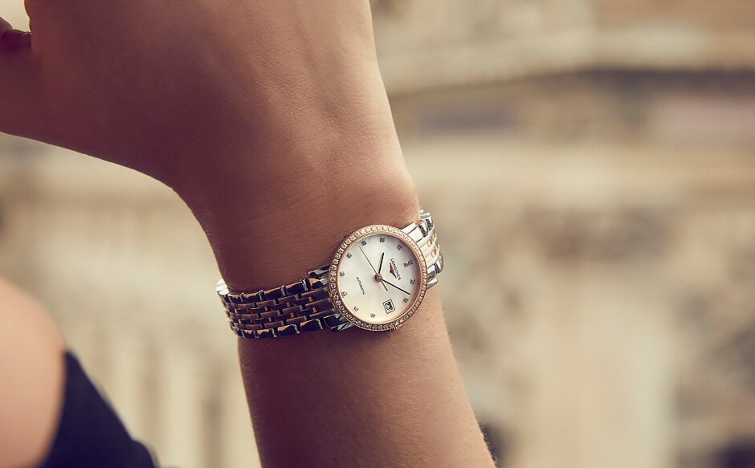 a Longines watch on a female wrist