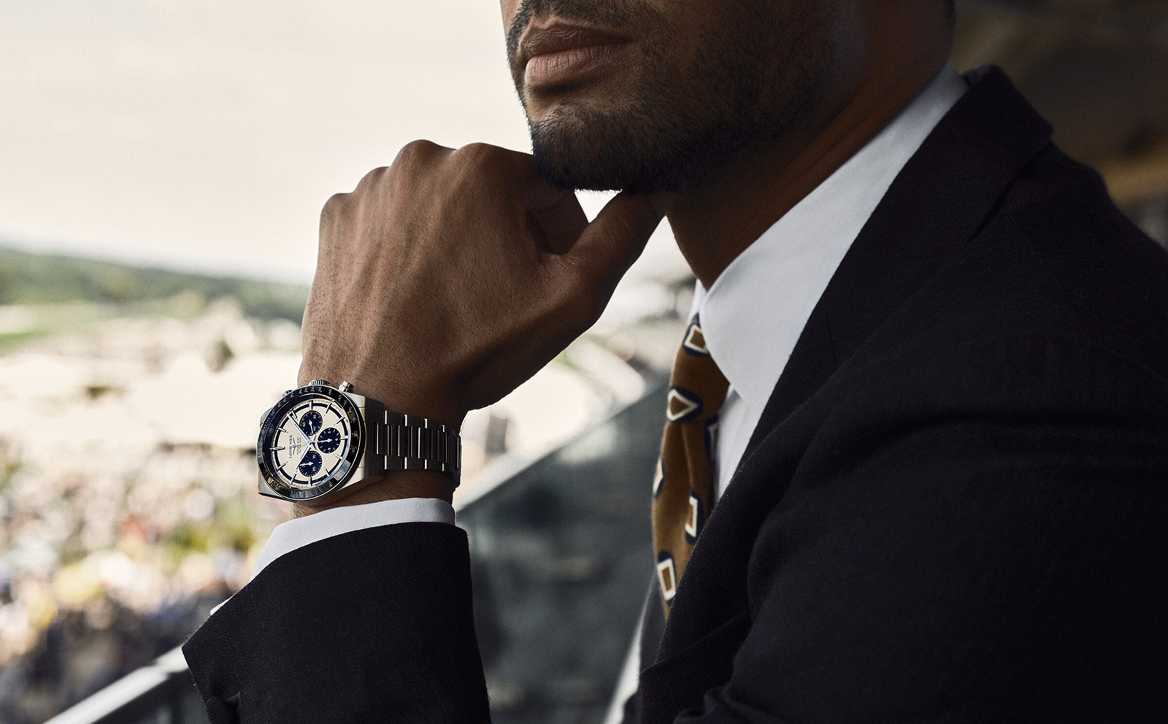 René-jean page wearing conquest in gold dial and steel bracelet 1600X992