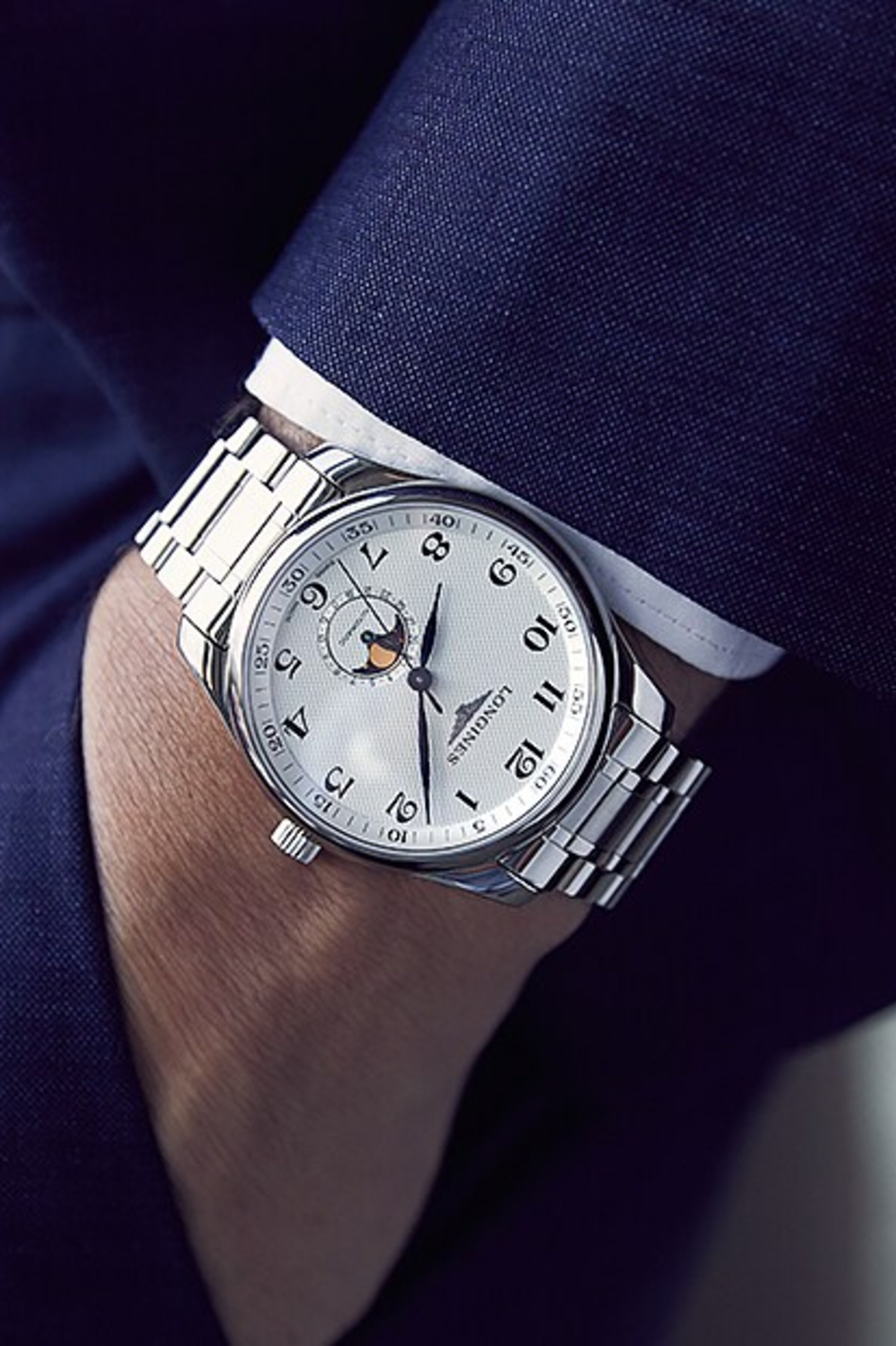 a Longines watch on a wrist
