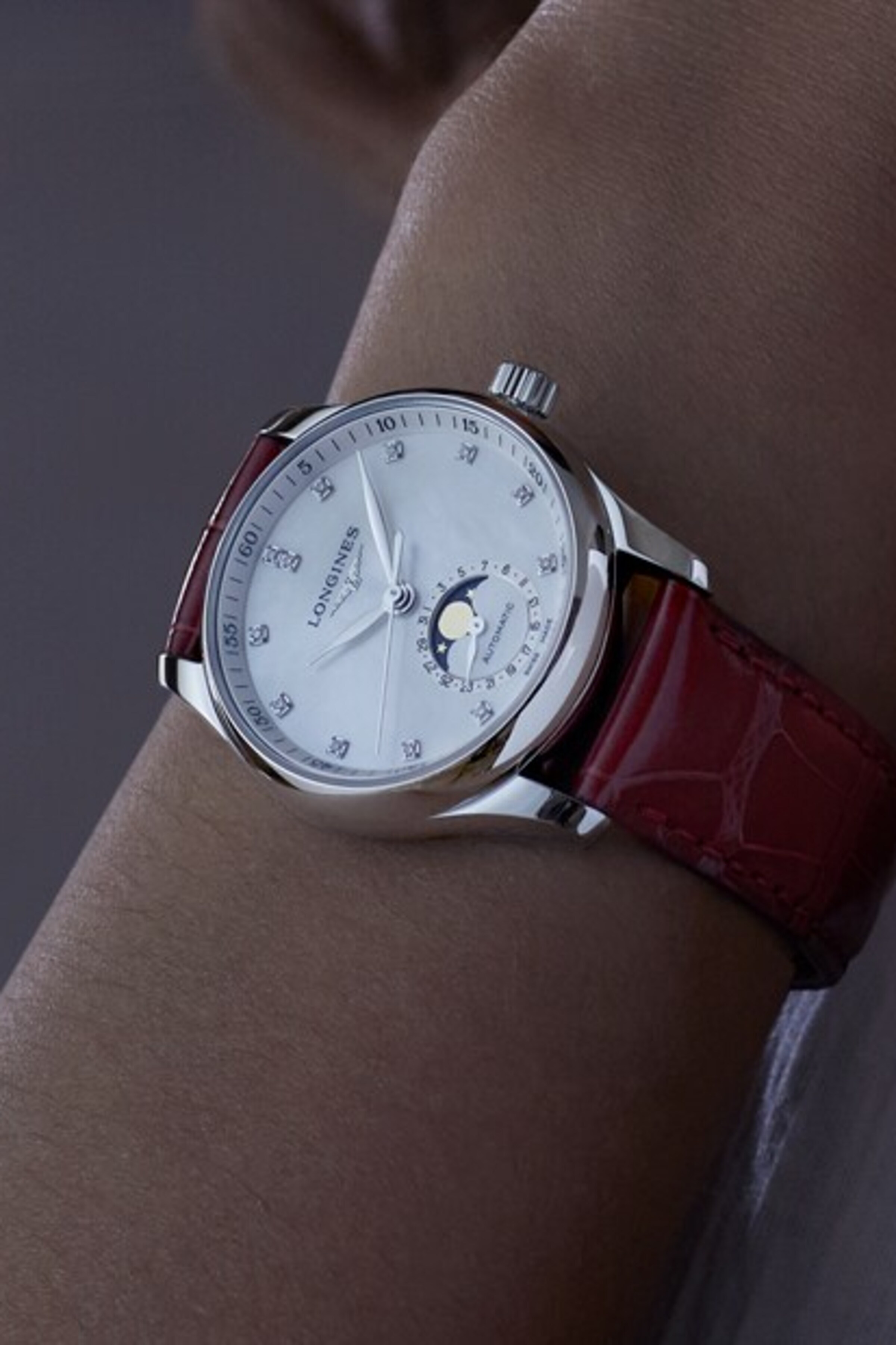 The Longines Master Collection Moonphase watch with red strap