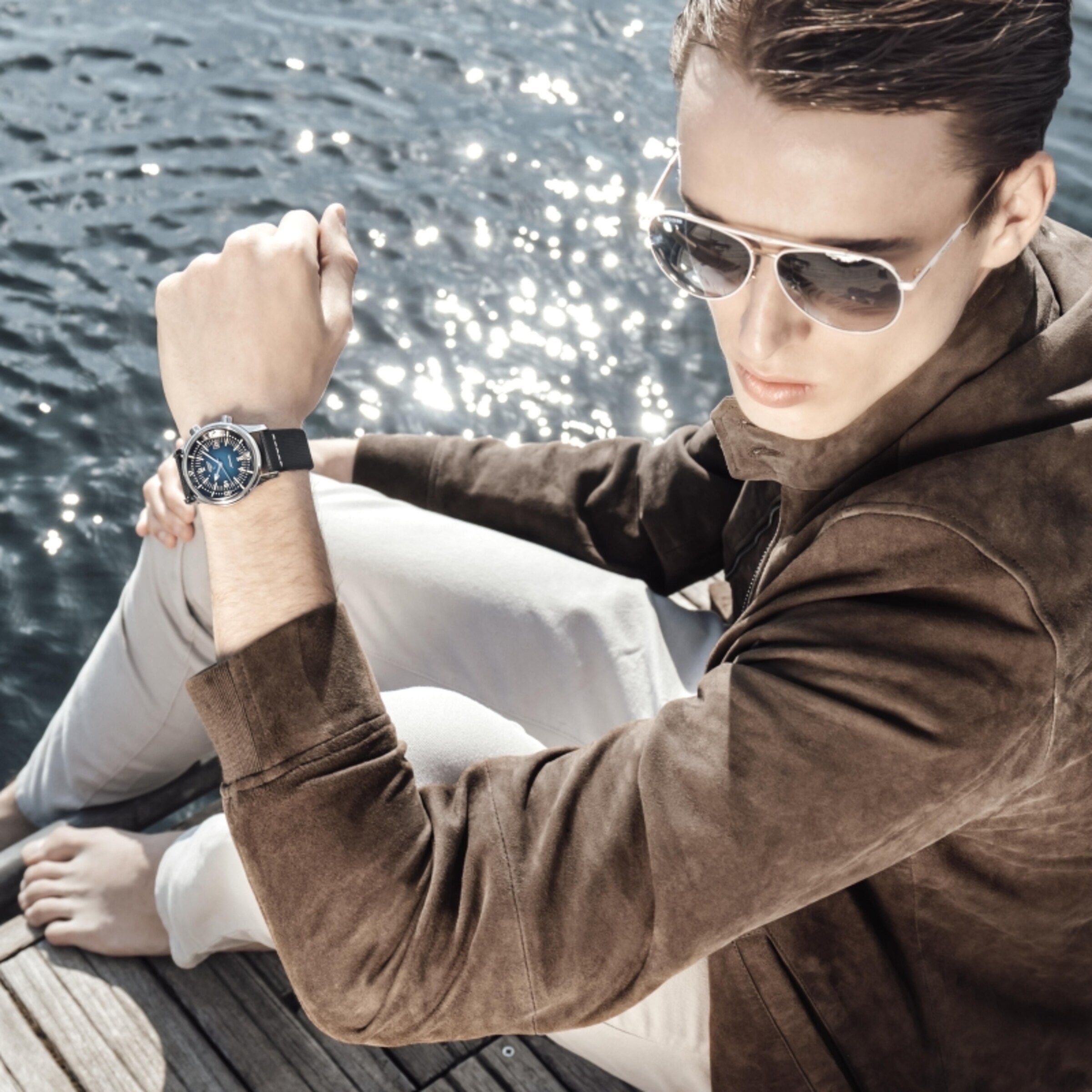 a man is wearing Longines Eyewear and watch